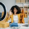 Beautiful lady blogger showing clothes in front of the camera to Videoberatung